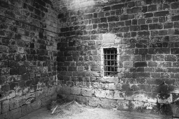 A jail with a grated window.